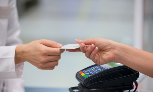 Handing over a card at counter